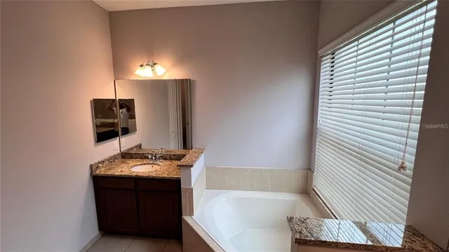 a room with gym equipment and view of living room