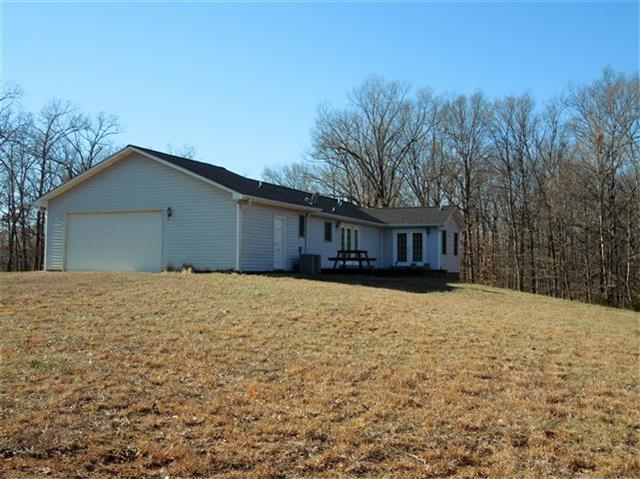118 Lynn Road Dover, TN 37058 - Photo 3 of 19 Side-back view. Garage on each level. Large patio.