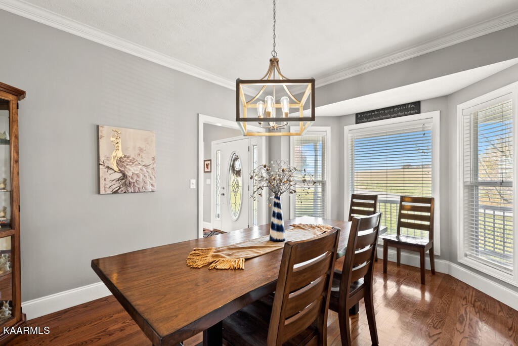 2582 Meadow Road West Greenback, TN 37742 - Photo 15 of 60 a view of a dining room with furniture window and wooden floor