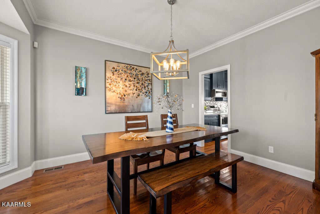 2582 Meadow Road West Greenback, TN 37742 - Photo 16 of 60 a view of a dining room with furniture window and wooden floor