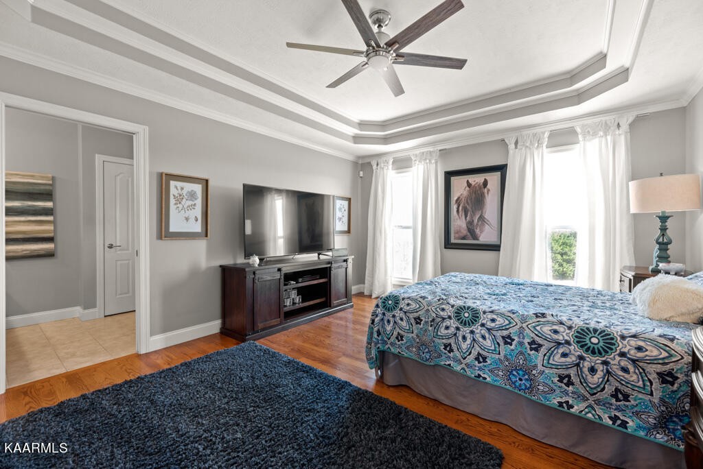 2582 Meadow Road West Greenback, TN 37742 - Photo 18 of 60 a bedroom with a bed and a flat screen tv