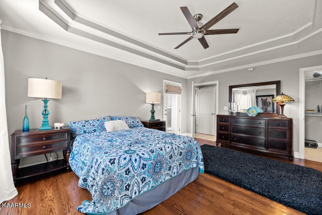 2582 Meadow Road West Greenback, TN 37742 - Photo 19 of 60 a bedroom with a bed and wooden floor