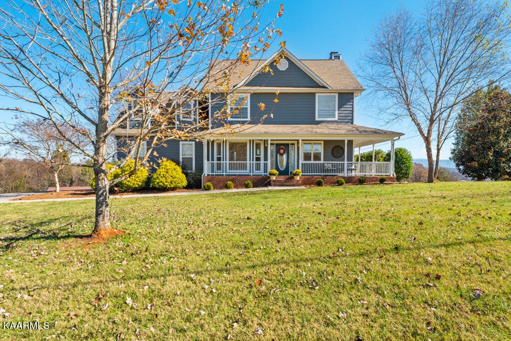 2582 Meadow Road West Greenback, TN 37742 - Photo 2 of 60 a front view of a house with a yard covered with green space