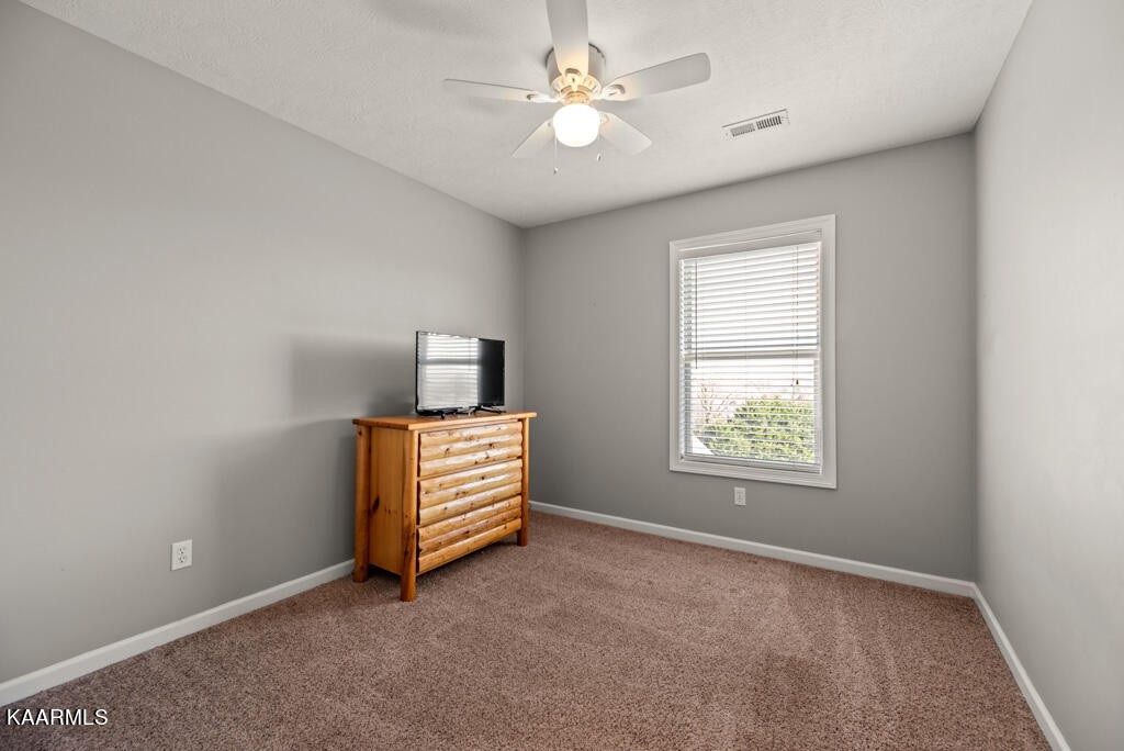 2582 Meadow Road West Greenback, TN 37742 - Photo 30 of 60 an empty room with windows and fan