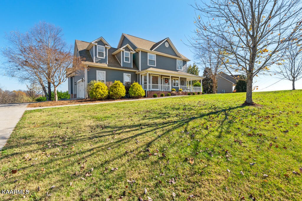 2582 Meadow Road West Greenback, TN 37742 - Photo 3 of 60 a front view of a house with a yard covered with trees