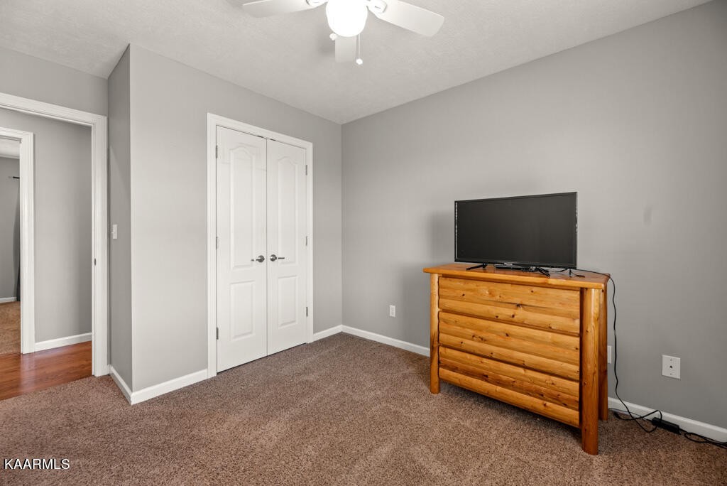2582 Meadow Road West Greenback, TN 37742 - Photo 31 of 60 a view of room with flat screen tv and stairs