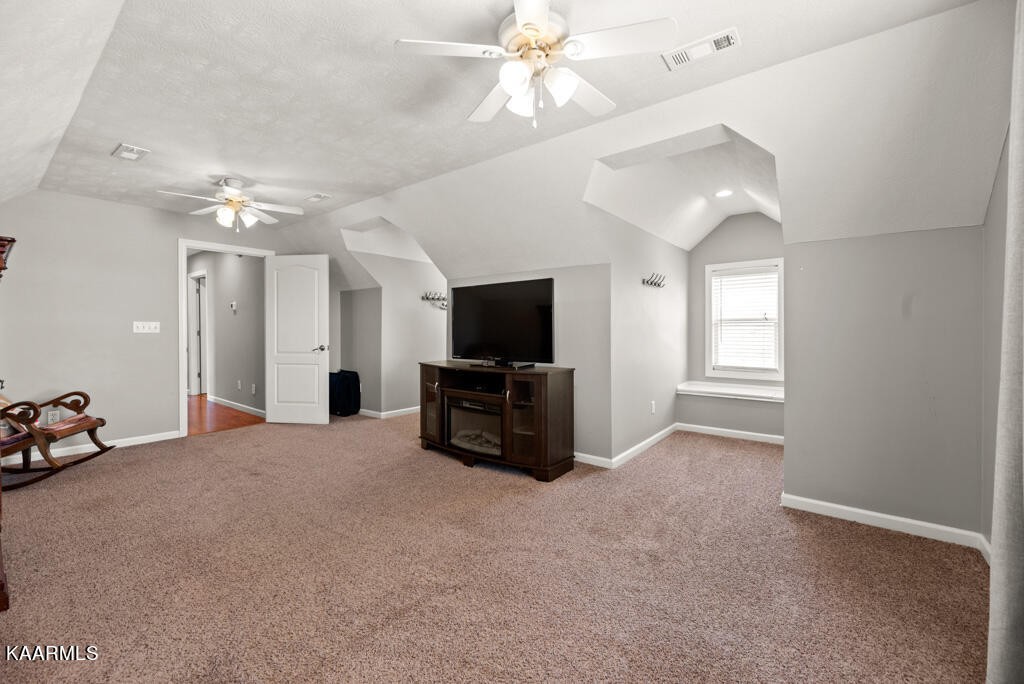 2582 Meadow Road West Greenback, TN 37742 - Photo 33 of 60 a living room with furniture and a flat screen tv