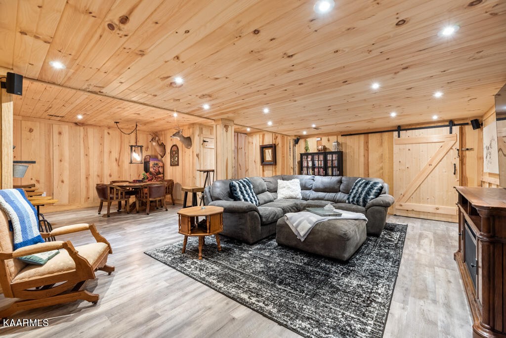 2582 Meadow Road West Greenback, TN 37742 - Photo 38 of 60 a living room with lots of furniture and wooden floor