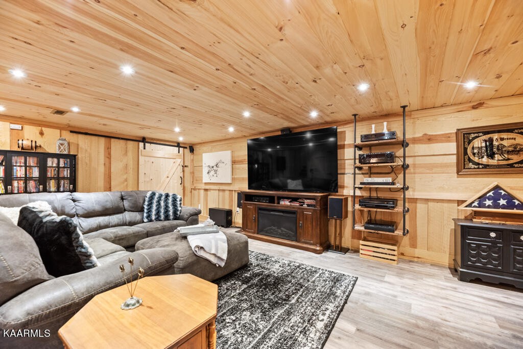 2582 Meadow Road West Greenback, TN 37742 - Photo 39 of 60 a living room with furniture and a flat screen tv