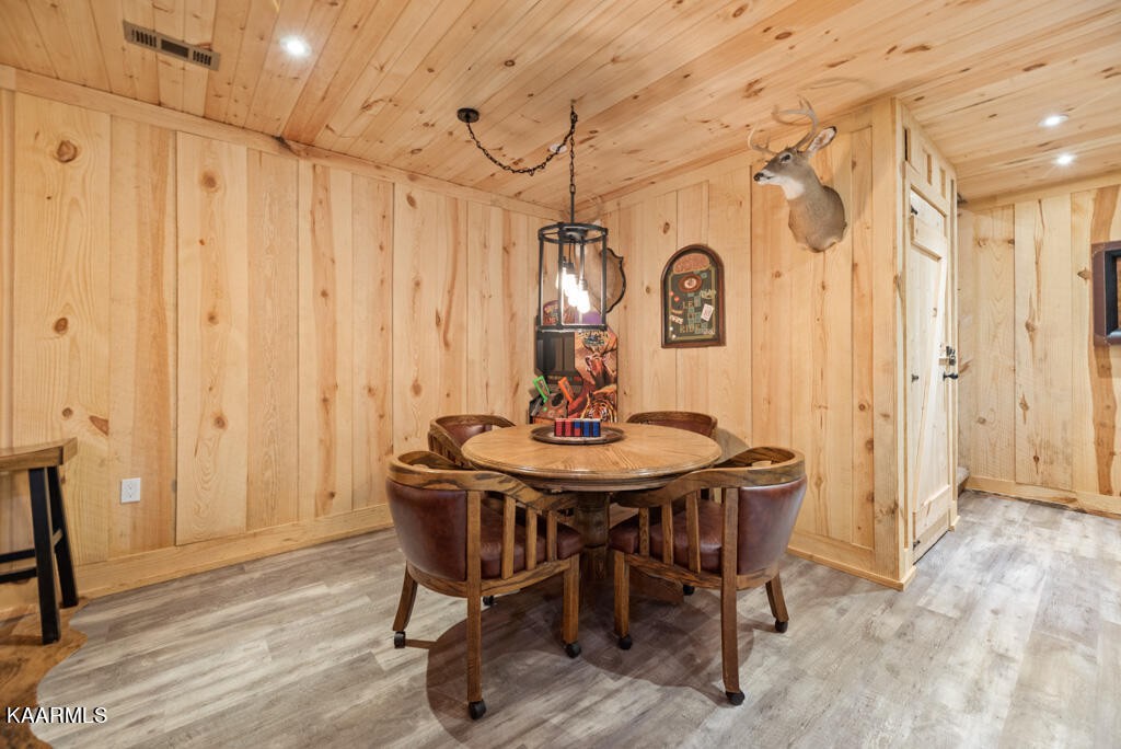 2582 Meadow Road West Greenback, TN 37742 - Photo 45 of 60 a view of a dining room with furniture and a chandelier