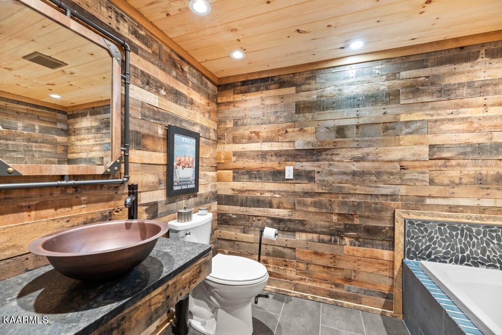 2582 Meadow Road West Greenback, TN 37742 - Photo 47 of 60 a bathroom with a sink toilet a mirror and shower