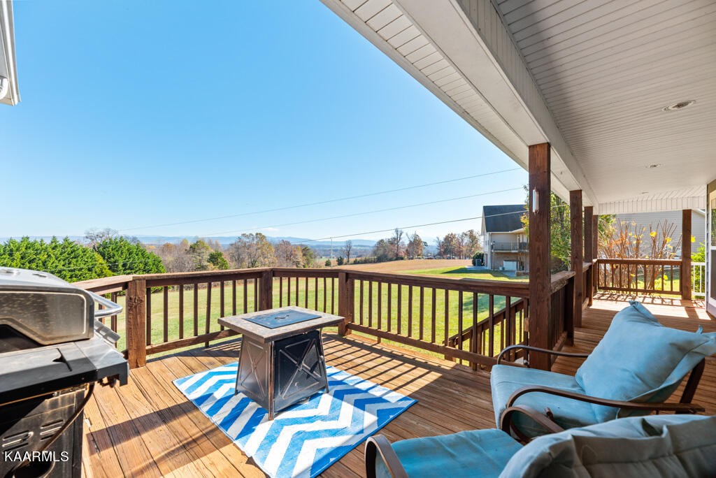 2582 Meadow Road West Greenback, TN 37742 - Photo 51 of 60 a balcony with wooden floor table and chairs