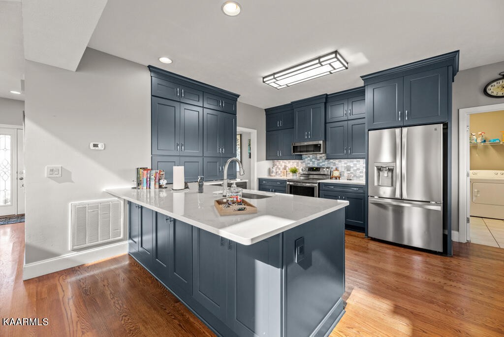 2582 Meadow Road West Greenback, TN 37742 - Photo 10 of 60 a kitchen with kitchen island a sink appliances and cabinets