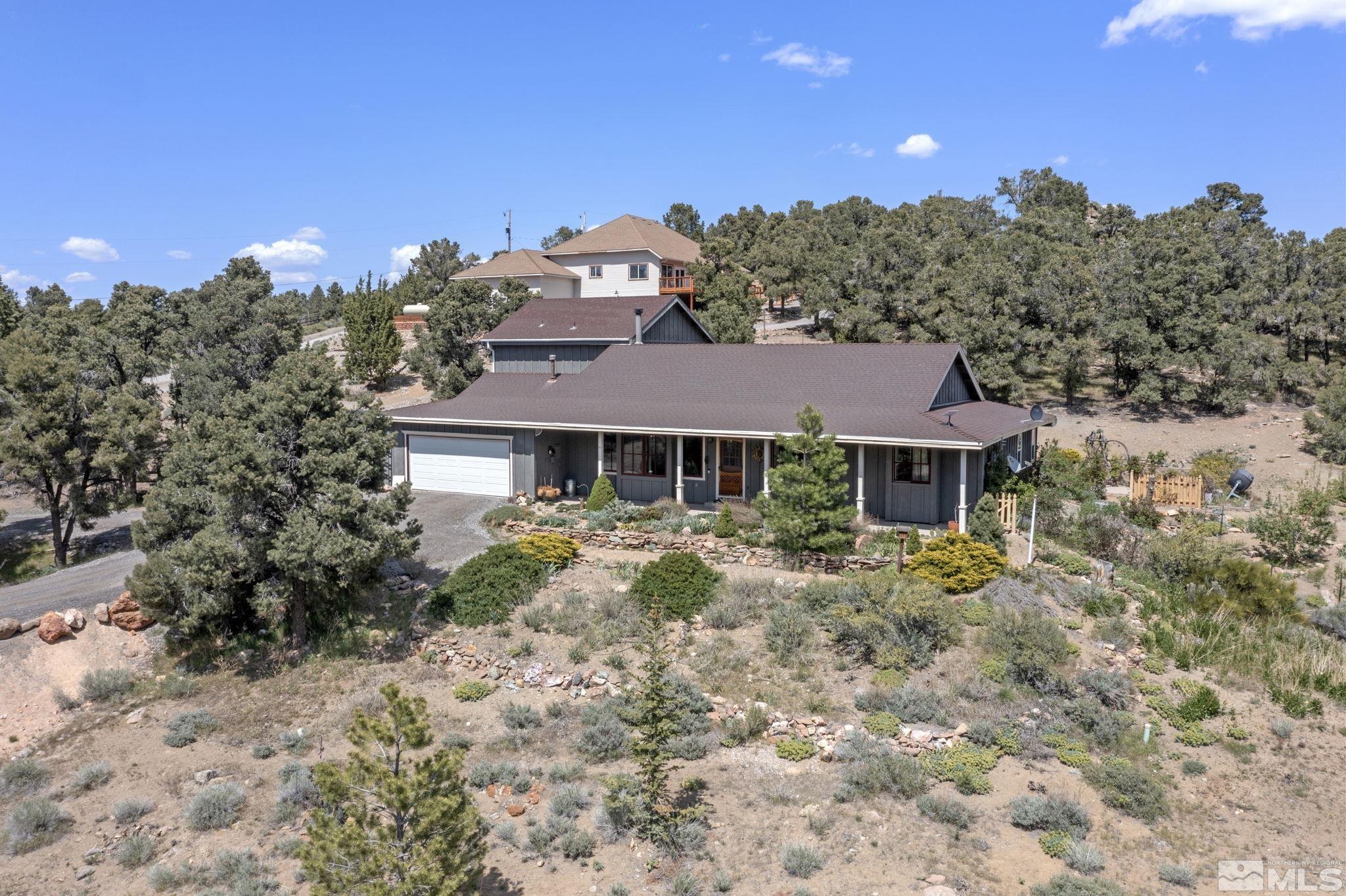 21410 Sazarac Road Reno, NV 89521 - Photo 1 of 38 a front view of a house with a yard