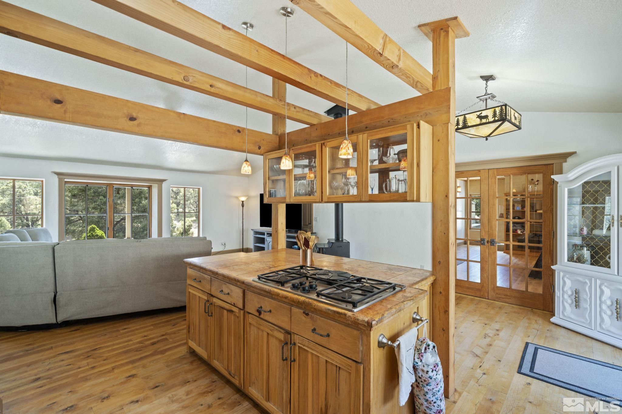 21410 Sazarac Road Reno, NV 89521 - Photo 11 of 38 a kitchen that has a stove and a wooden floor