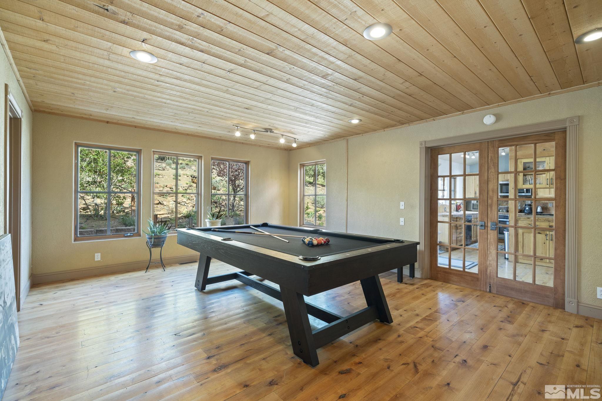 21410 Sazarac Road Reno, NV 89521 - Photo 13 of 38 a room with furniture pool table wooden floor and furniture