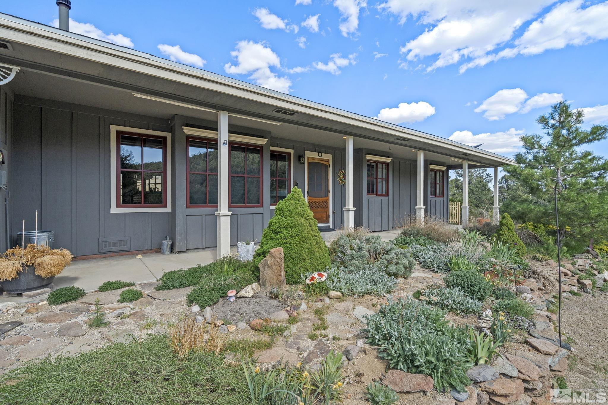21410 Sazarac Road Reno, NV 89521 - Photo 2 of 38 a front view of a house with garden