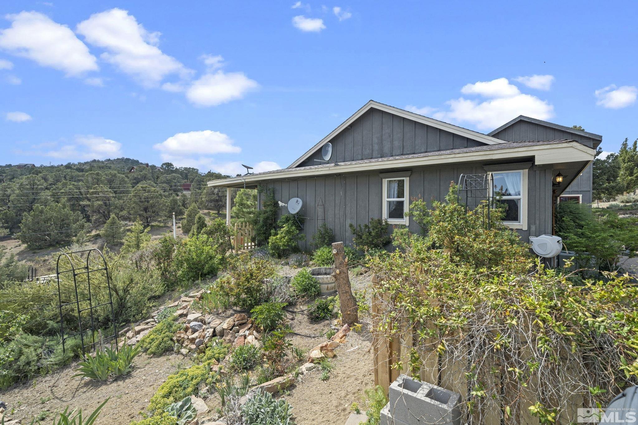 21410 Sazarac Road Reno, NV 89521 - Photo 24 of 38 a view of a house with a yard