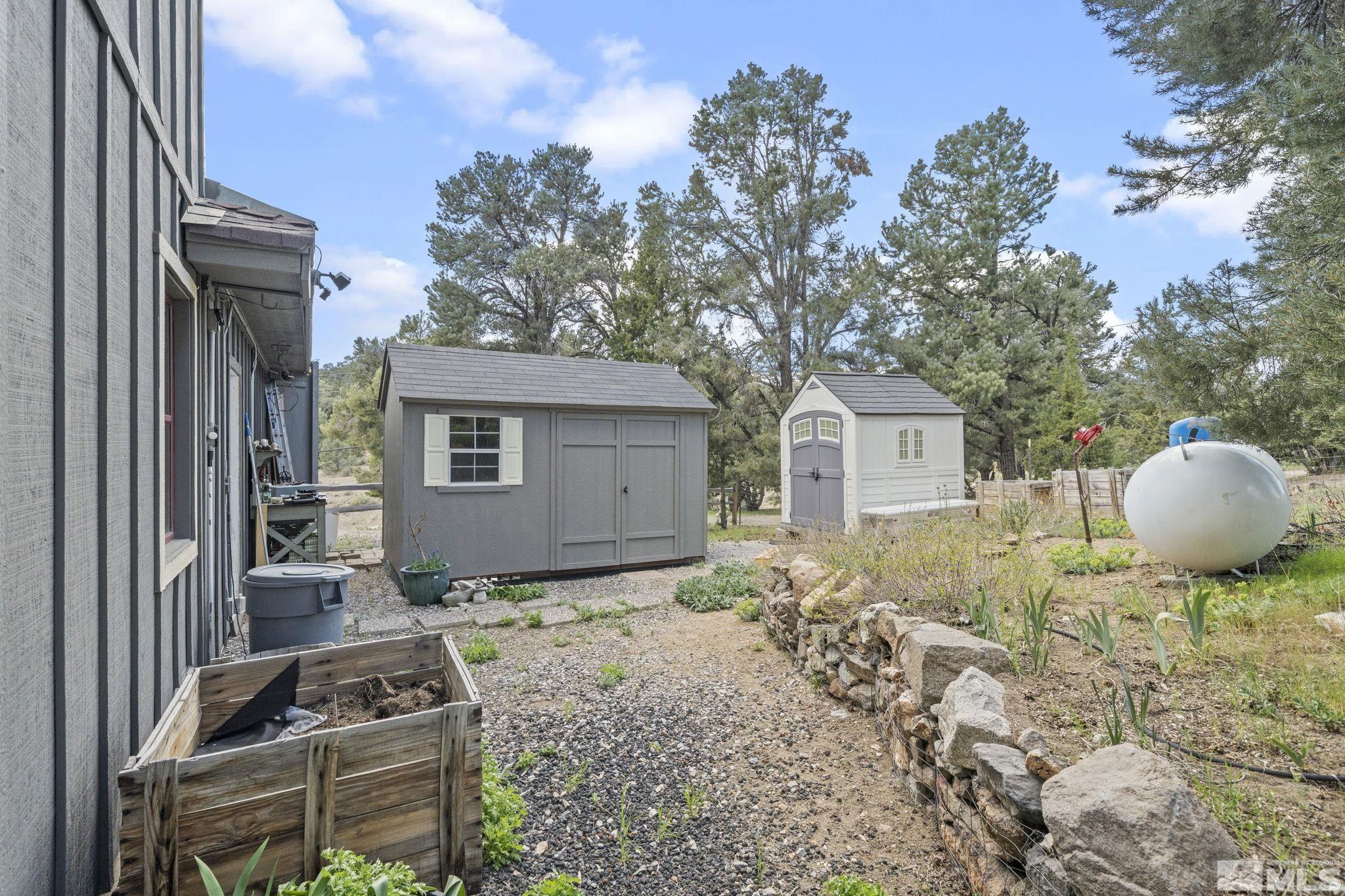 21410 Sazarac Road Reno, NV 89521 - Photo 27 of 38 a front view of a house with garden