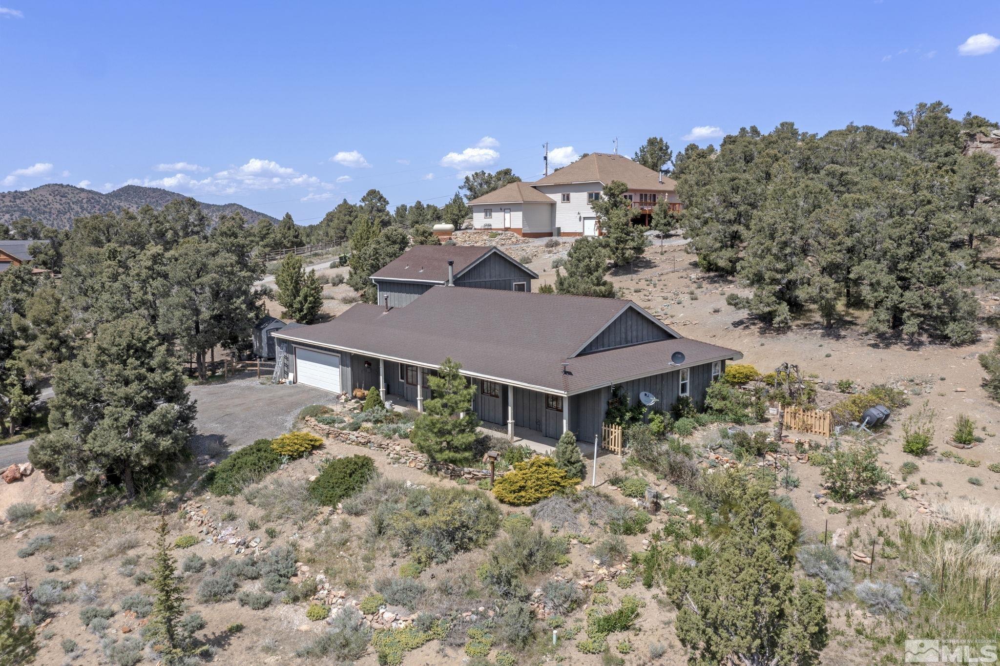 21410 Sazarac Road Reno, NV 89521 - Photo 32 of 38 a aerial view of a house with a yard and mountain view in back