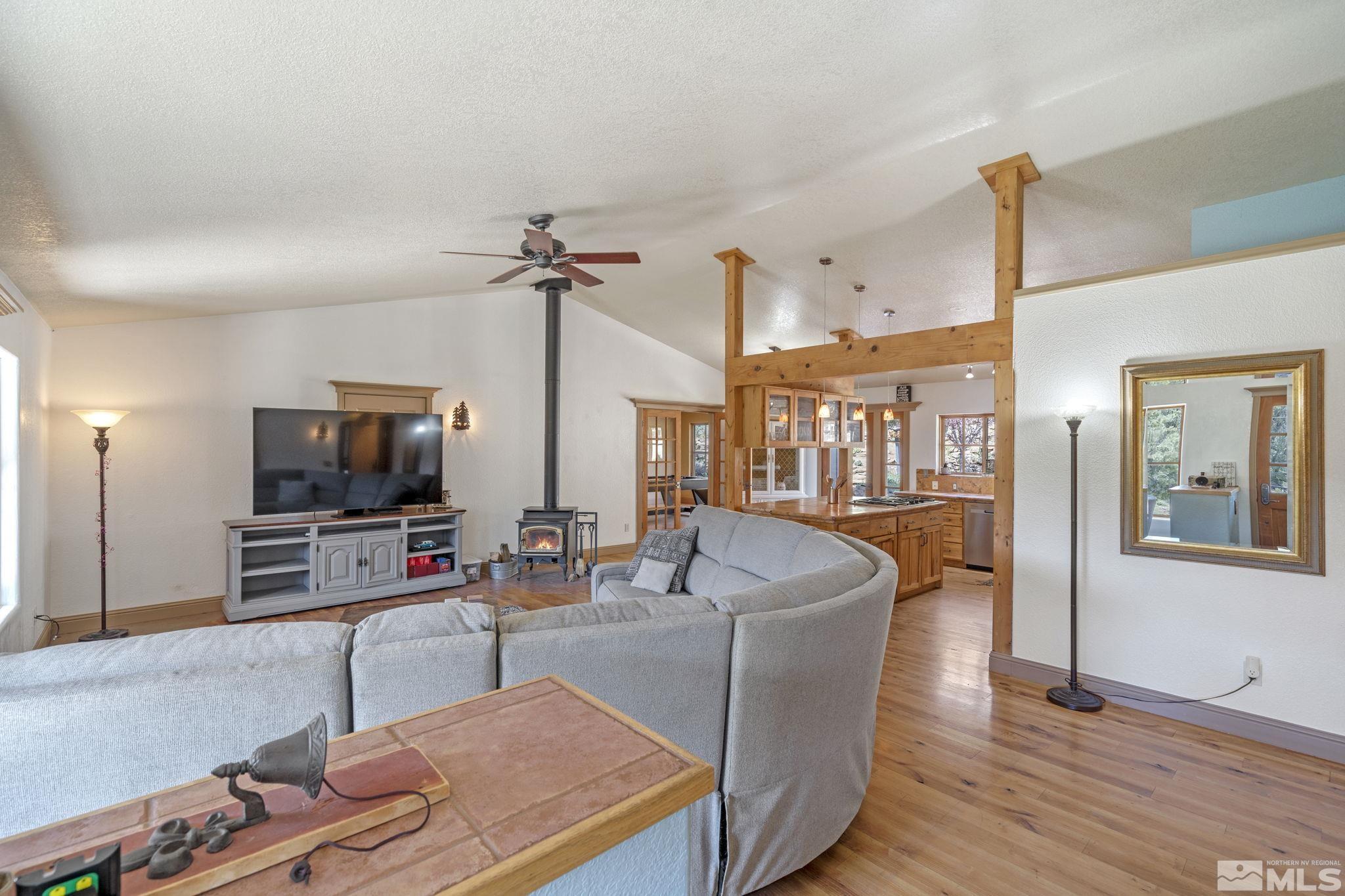 21410 Sazarac Road Reno, NV 89521 - Photo 4 of 38 a living room with furniture and a flat screen tv