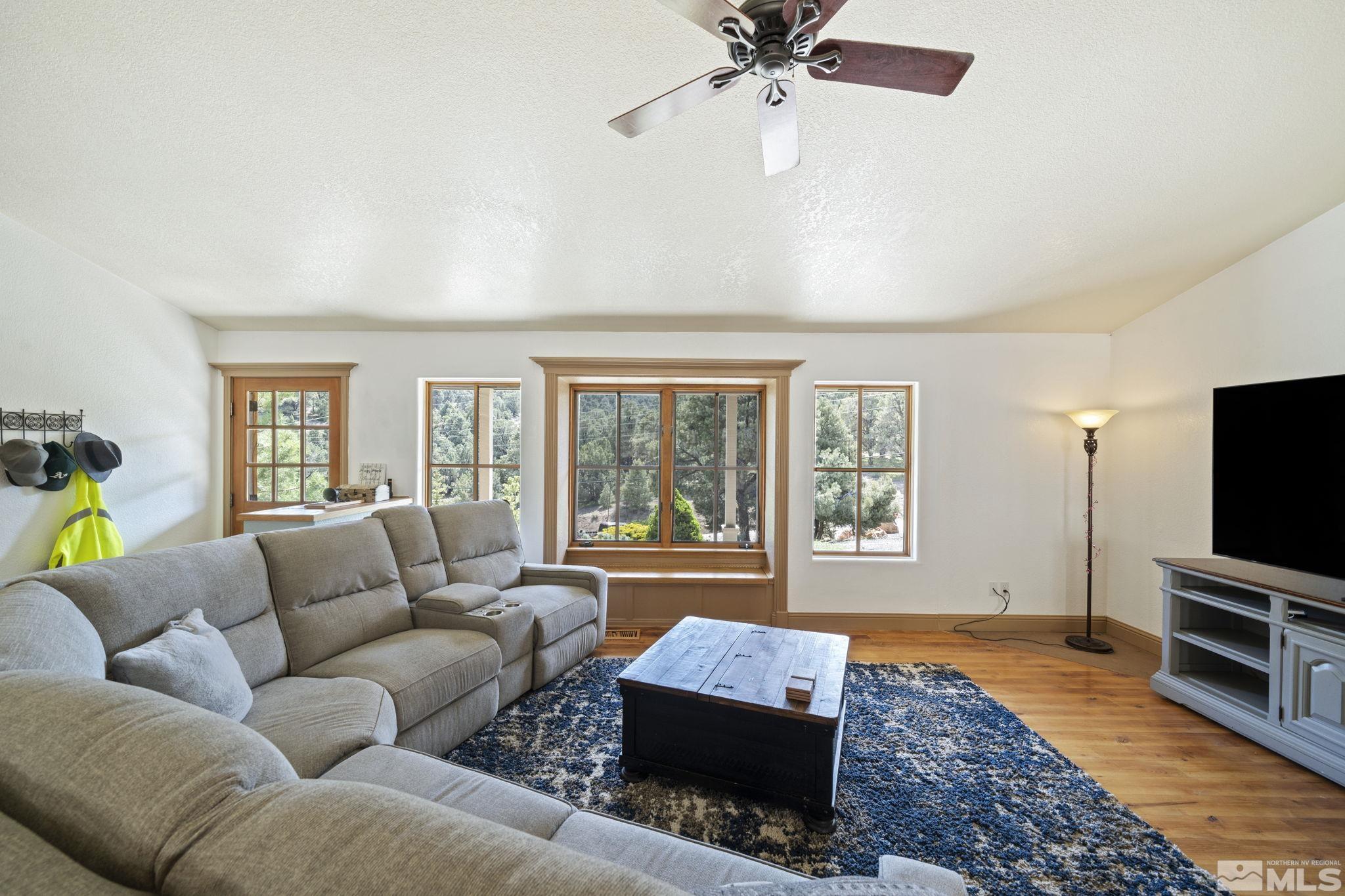 21410 Sazarac Road Reno, NV 89521 - Photo 5 of 38 a living room with furniture and a flat screen tv