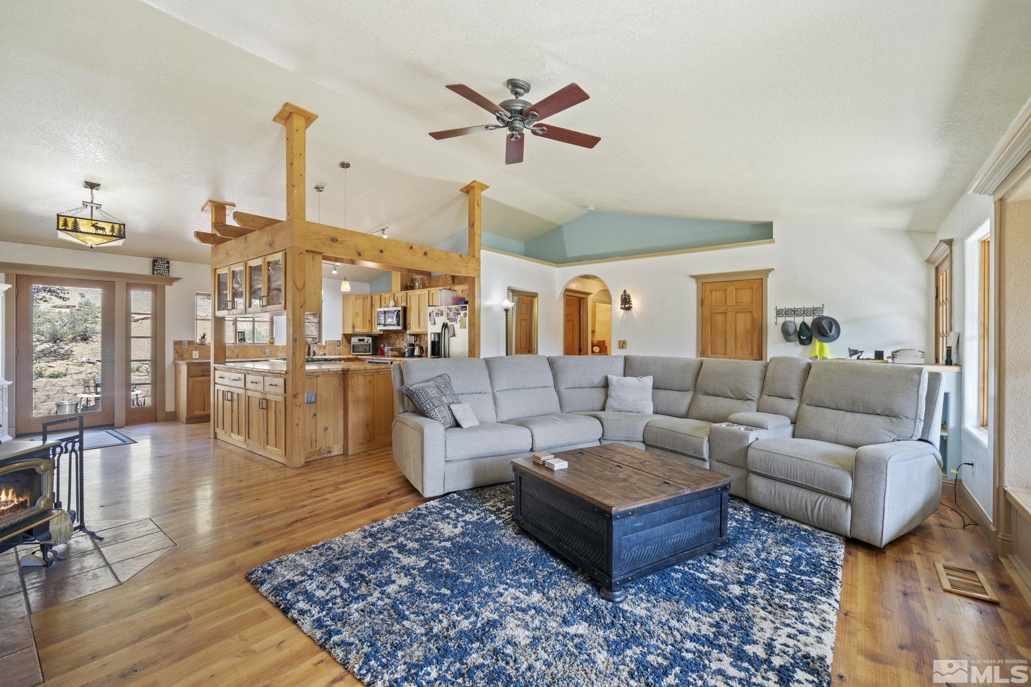 21410 Sazarac Road Reno, NV 89521 - Photo 10 of 38 a living room with furniture ceiling fan and a rug