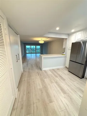 a view of a room with wooden floor and staircase