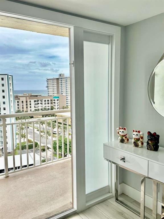 299 North Riverside Drive, Unit PH 5 Pompano Beach, FL 33062 - Photo 6 of 19 a view of a bathroom with a sink and mirror