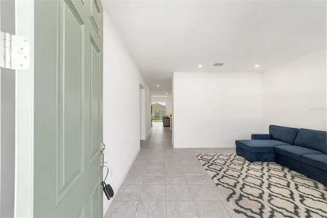 a living room with furniture and a rug