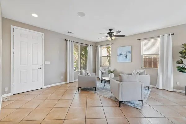 a kitchen with stainless steel appliances granite countertop a sink counter space cabinets and a large window