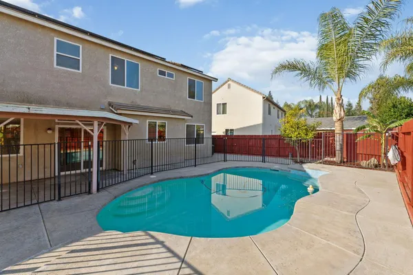 a view of a hallway with wooden floor and entryway