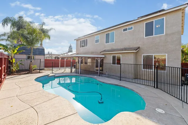a view of a house with a swimming pool