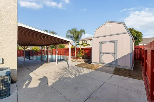 a view of backyard with a patio and a garden