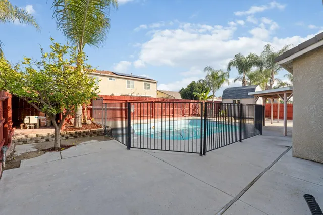 a view of a wrought iron fences in front of house