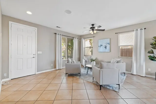 a living room with furniture and windows