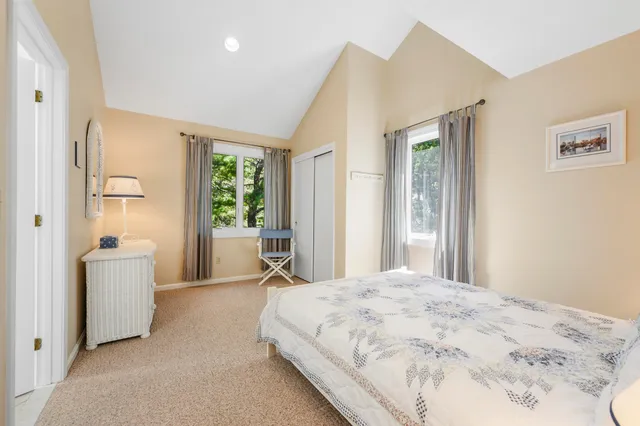 a bedroom with a bed furniture and a window