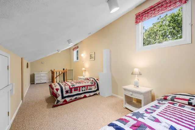 a bedroom with bed and a window