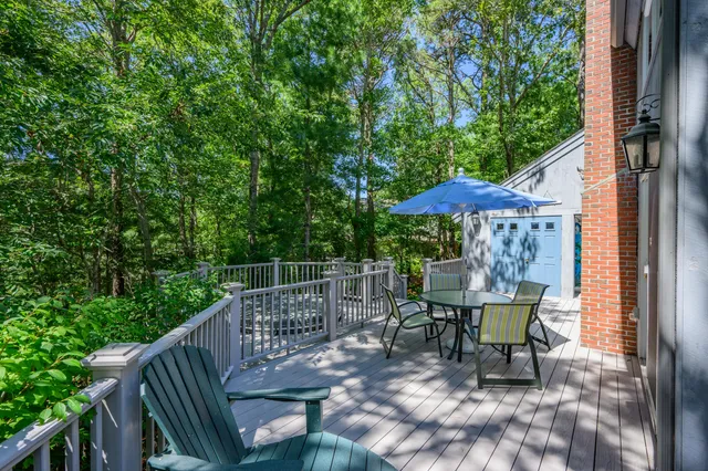 a view of a chair and table in the balcony