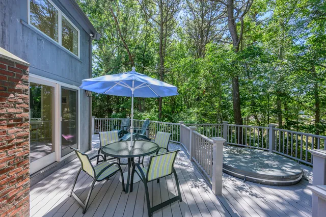a view of deck with furniture and barbeque oven