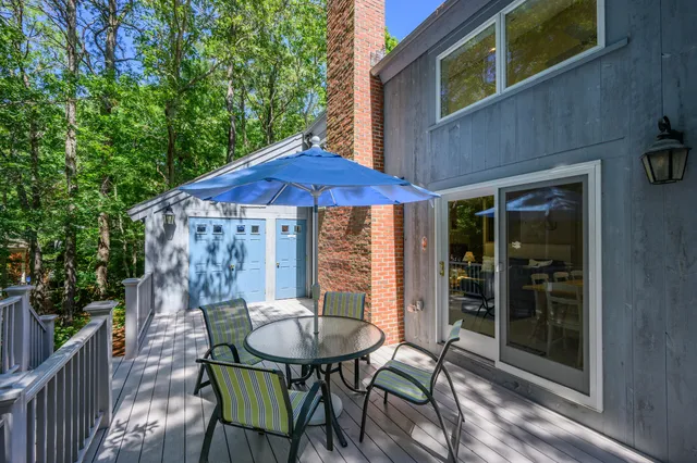 a view of a table and chairs in patio of the house