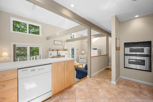 a kitchen with stainless steel appliances a refrigerator and a sink