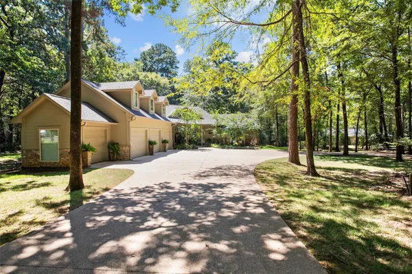 a view of a house with a tree in the background
