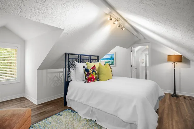 a bathroom with a sink mirror toilet and shower
