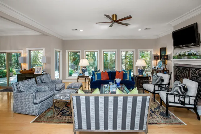 a living room with fireplace furniture and a flat screen tv