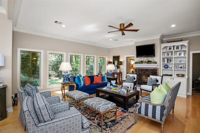 a living room with fireplace furniture and a flat screen tv