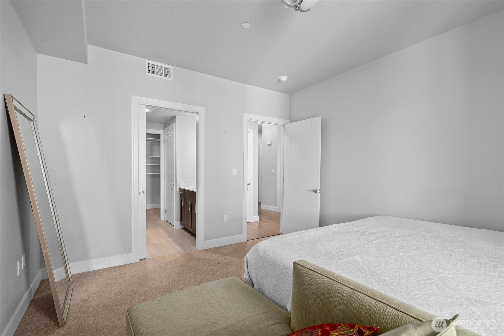 4961 Main Street, Unit 710 Tacoma, WA 98407 - Photo 11 of 24 a bedroom with a bed and walk in closet
