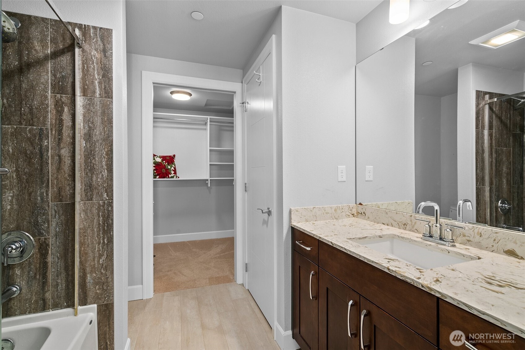 4961 Main Street, Unit 710 Tacoma, WA 98407 - Photo 12 of 24 a bathroom with a granite countertop sink and a mirror
