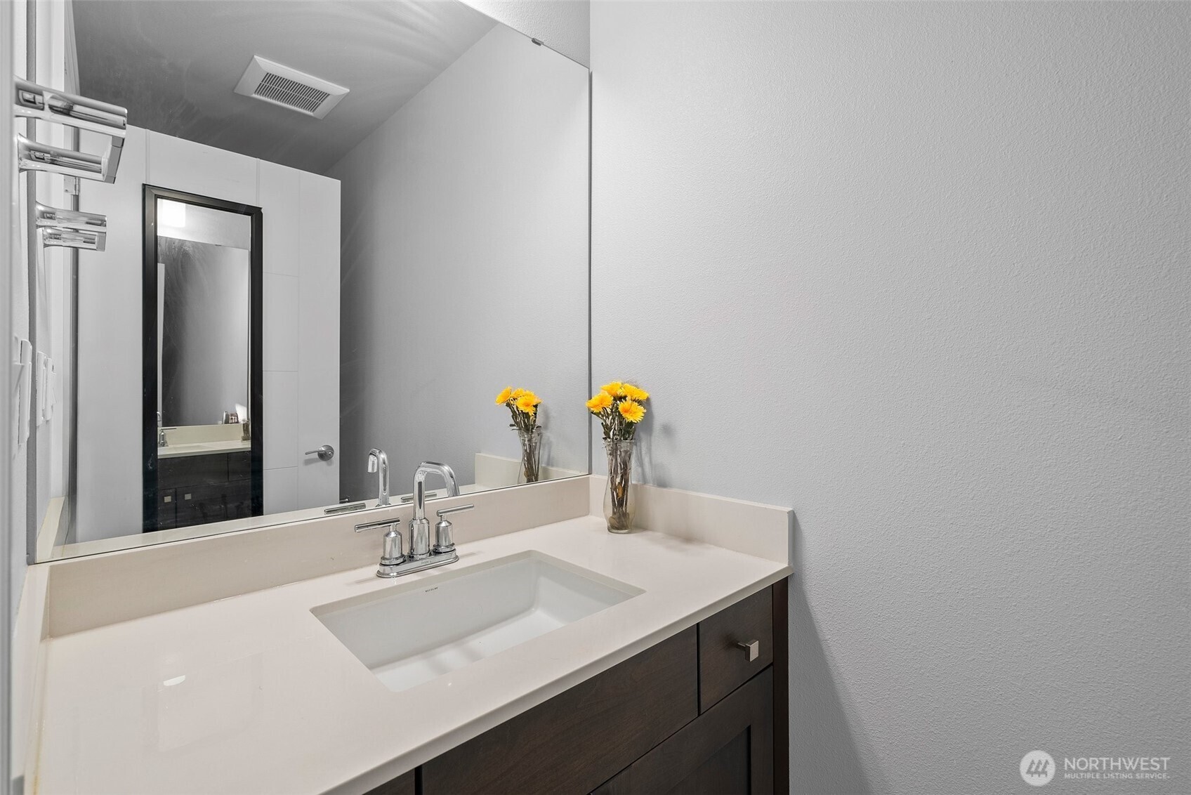 4961 Main Street, Unit 710 Tacoma, WA 98407 - Photo 14 of 24 a bathroom with a sink and a mirror