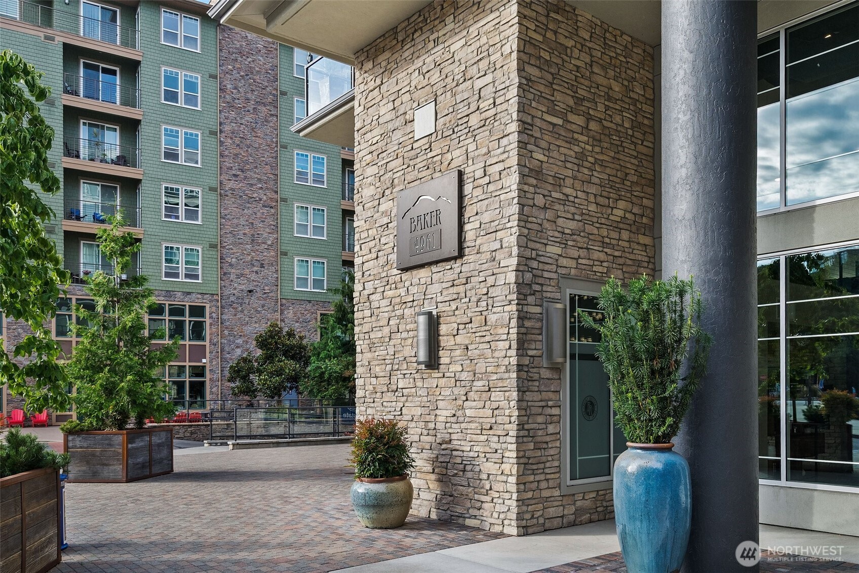 4961 Main Street, Unit 710 Tacoma, WA 98407 - Photo 17 of 24 a view of building with potted plants